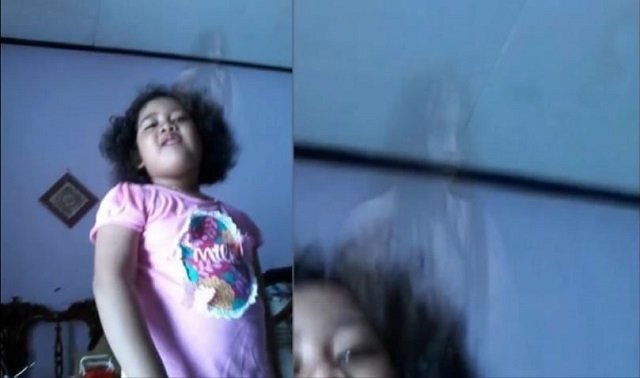 閲覧注意？ 5歳少女の頭上に「ゾッとする」ほど怖い女の地縛霊が写り込む！ まるで念写！＝インドネシアの画像1